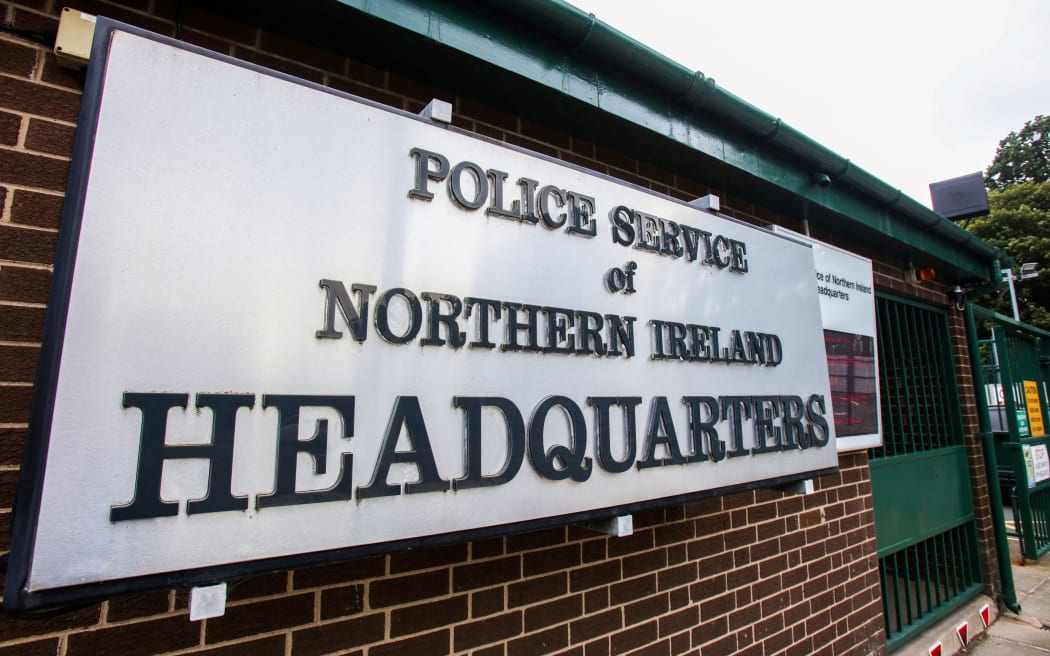 A photograph taken on August 10, 2023 shows the logo of the Police service of Northern Ireland (PSNI) at the entrance of the headquarters in Belfast. Authorities said they had mistakenly posted online the names and ranks of police officers in Northern Ireland, sparking fears the release could jeopardise their security. The error comes months after the terrorism threat level in the UK-run province was increased to