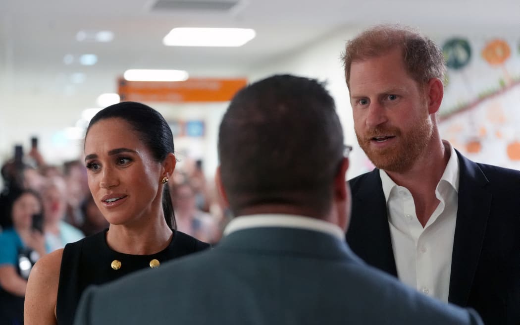 Britain's Prince Harry (R), Duke of Sussex, and his wife Meghan (L), the Duchess of Sussex, visit the Royal Children's Hospital in Melbourne on April 14, 2026. (Photo by Jonathan Brady / POOL / AFP)