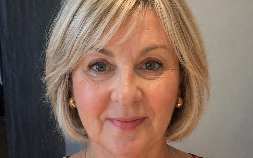This is a head shot of Vicki looking straight at the camera. She has a blonde bob.