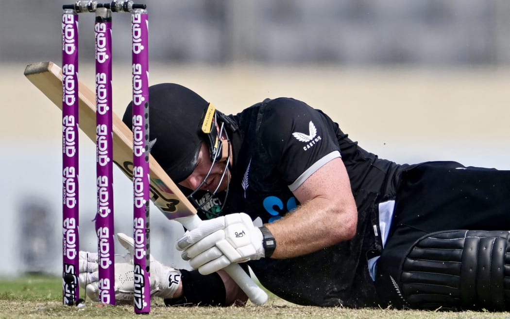 New Zealand's Nick Kelly reacts after being hit by the ball during the second one-day international (ODI) cricket match between Bangladesh and New Zealand at Sher-e-Bangla National Stadium in Mirpur on April 20, 2026. (Photo by Munir UZ ZAMAN / AFP)