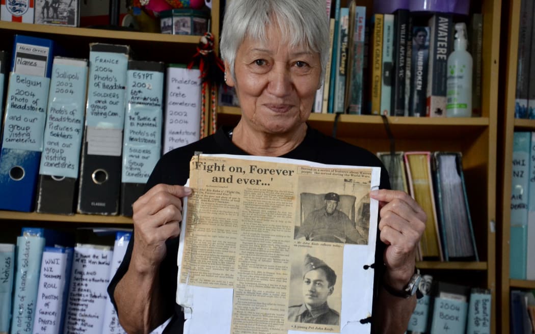 Juliana Keefe holds an article about her father, Private John Keefe, part of the records she has spent decades compiling on the 28th Māori Battalion.