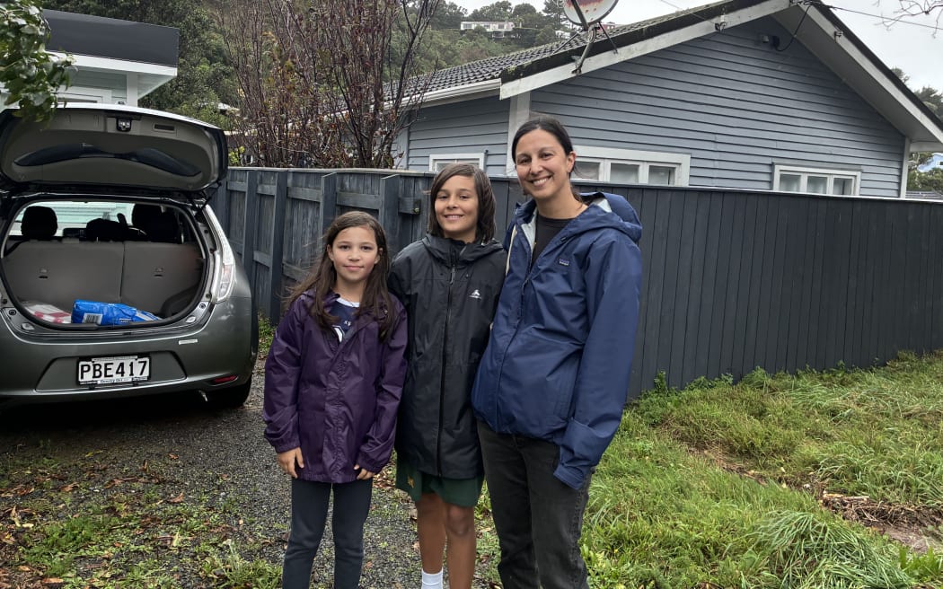 Owhiro Bay resident Nicole and her children getting ready to sandbag.