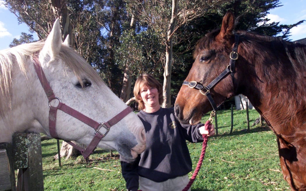 Adrienne Staples with her thoroughbred Spanish horses Mac, right and sire Catherino at the family property in Featherston.