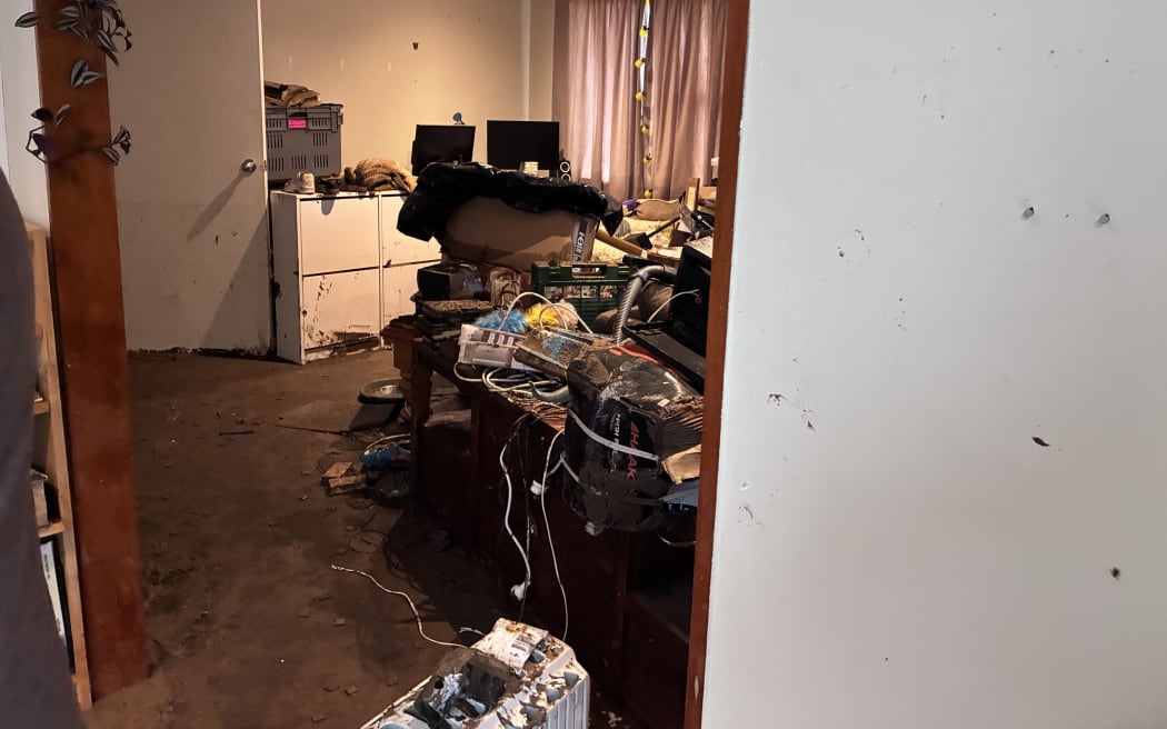 Flood damage inside a family home in Wellington's Ōwhiro Bay.