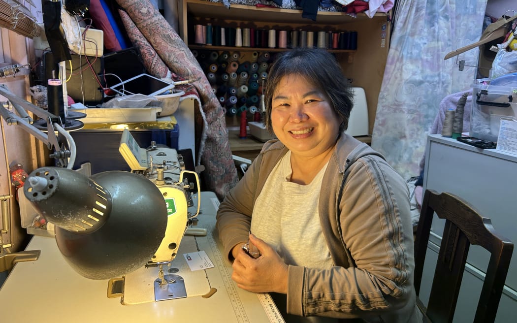 Picture depicts a 50-year-old woman smiling at the camera.