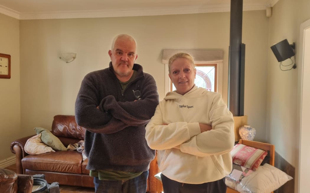 Andrew and Jenny Frazer were among the Pāuatahanui residents cleaning up on 19 April, 2026, following flash flooding the day before.