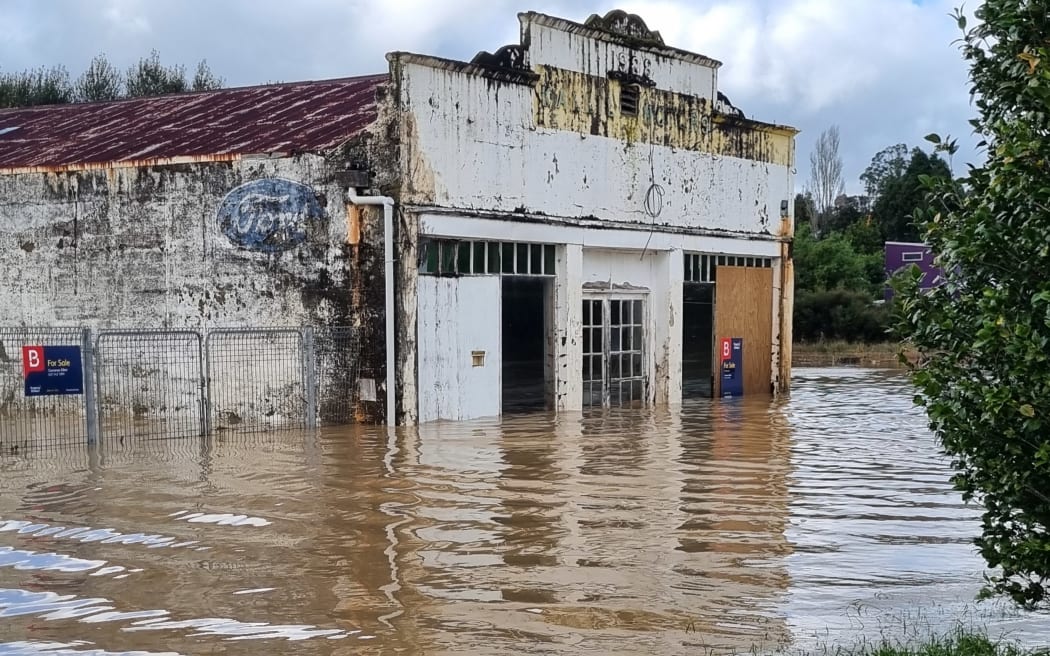 Flooding at the old garage in Ōhura's town centre on 19 April, 2026. A local resident said by the time this photo was taken, the water had gone down about half a metre or more.