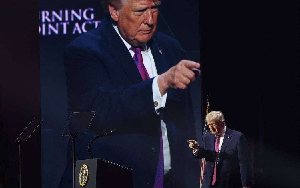 PHOENIX, ARIZONA - APRIL 17: U.S. President Donald Trump greets supporters after speaking at a Turning Point USA event at the Dream City Church on April 17, 2026 in Phoenix, Arizona. The event was titled “Build the Red Wall”, intended to turn out young voters for the midterm elections.   Win McNamee/Getty Images/AFP (Photo by WIN MCNAMEE / GETTY IMAGES NORTH AMERICA / Getty Images via AFP)