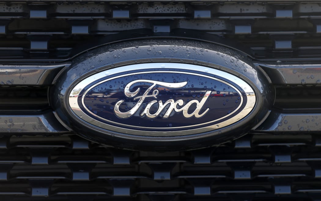 COLMA, CALIFORNIA - JANUARY 06: The Ford logo is visible on a pickup truck displayed on the sales lot at Serramonte Ford on January 06, 2026 in Colma, California. Ford Motor reported a 6 percent increase in 2025 sales, the company's best annual sales since 2019. The automaker reported sales of 2.2 million vehicles in 2025, including an 8.3 percent surge in sales of the popular F-150 pickup truck. Justin Sullivan/Getty Images/AFP (Photo by JUSTIN SULLIVAN / GETTY IMAGES NORTH AMERICA / Getty Images via AFP)