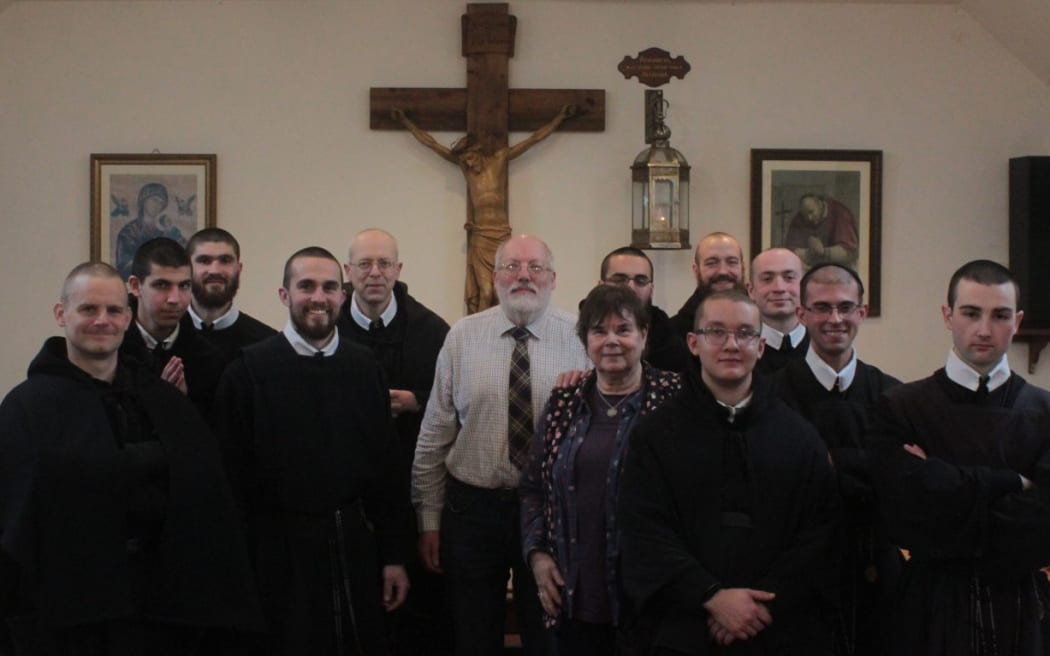 Stephen Clackson (C) and his wife Ute in the refectory during a visit with The Sons of The Most Holy Redeemer on Papa Stronsay. Justin Evans is third from the left.