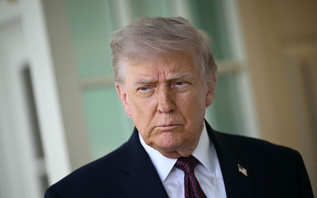 US President Donald Trump speaks to the press outside the Oval Office at the White House in Washington, DC, on April 13, 2026. Trump refused to apologize Monday for criticizing Pope Leo XIV, after the pontiff called for an end to violence in the Iran war. "There's nothing to apologize for. He's wrong," Trump told reporters, a day after a social media post and comments slamming the US-born pope. (Photo by Brendan SMIALOWSKI / AFP)