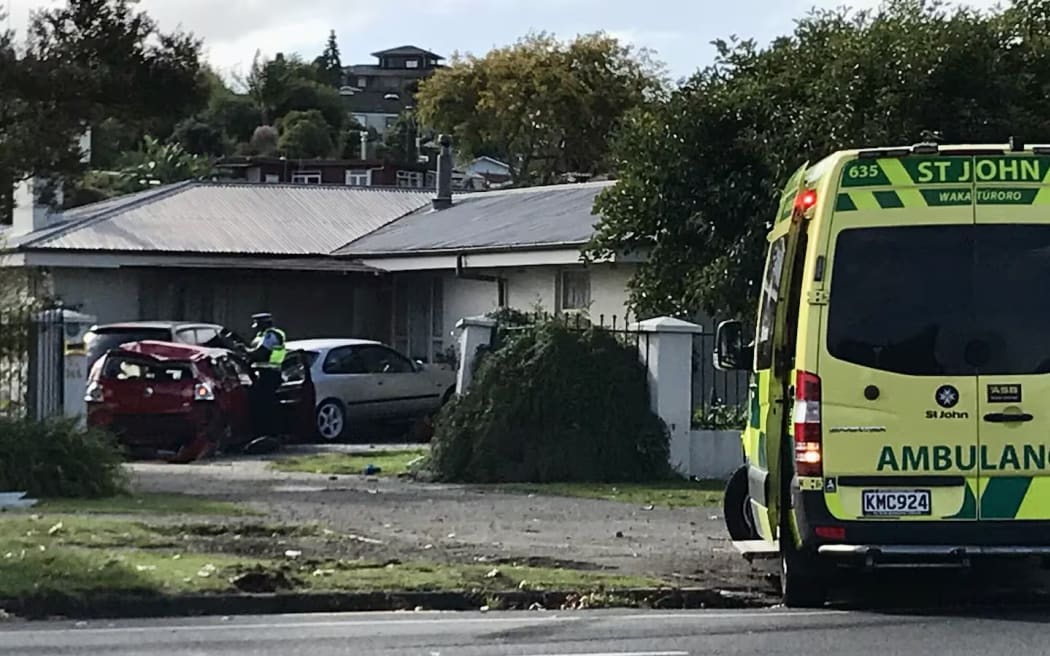 The car ploughed through the iron gates of this property and into the back of two parked cars.