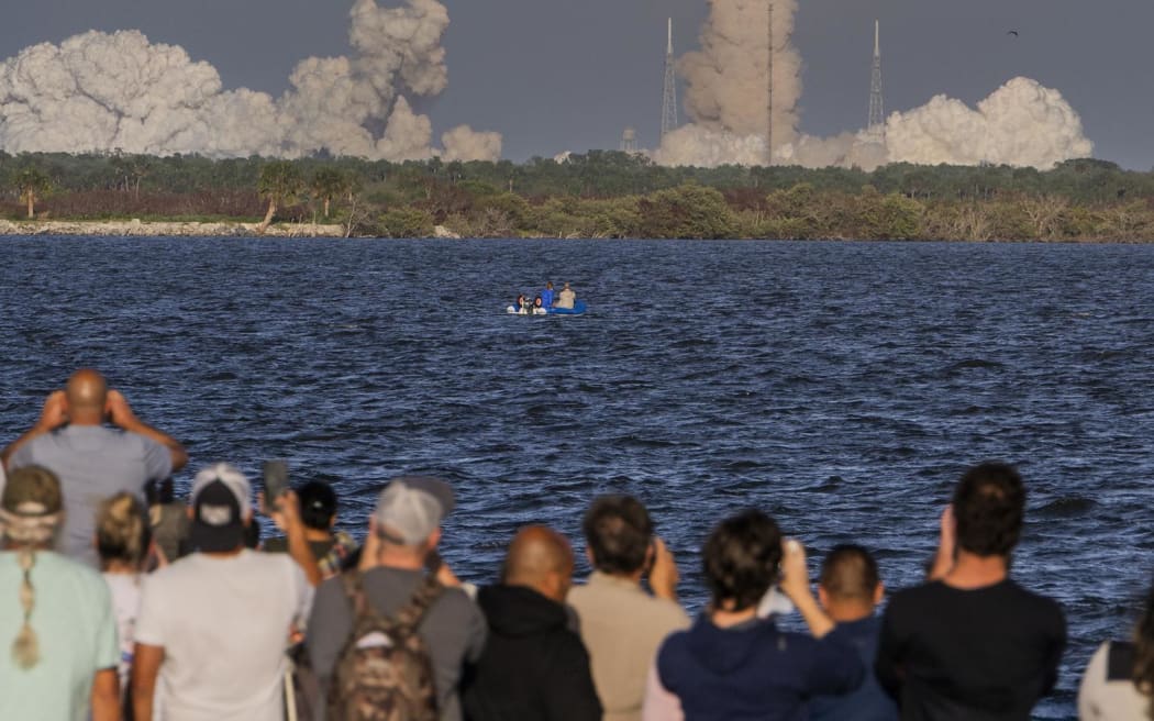 A crowd watches the lift off of NASA’s Orion spacecraft carrying the Artemis II crew on 1 April, 2026, from the Kennedy Space Centre in Florida.