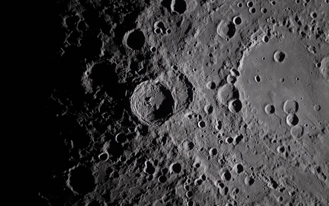 A close-up view taken by the Artemis II crew of Vavilov Crater on the Moon.