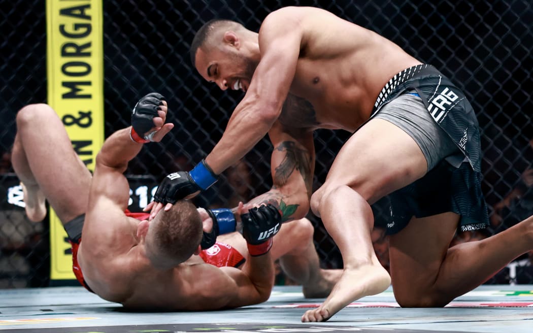 Carlos Ulberg of New Zealand, (R), punches Jiri Prochazka of Czechia in a light heavyweight title bout during UFC 327 at the Kaseya Center on April 11, 2026 in Miami, Florida.