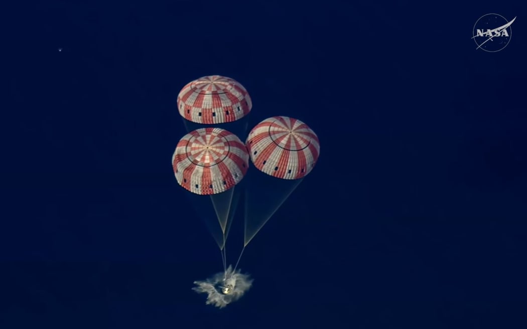 The capsule splashes down, ending the Artemis II moon mission.