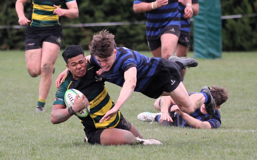 Rangiora High School first 15 player Suliasi Uhatafe is tackled during the 2024 Miles Toyota Championship rugby final against the Christchurch Boys’ High School second 15 at Rangiora. The match ended in a draw, which was enough for Rangiora to gain promotion to last year’s Crusaders schools premiership.