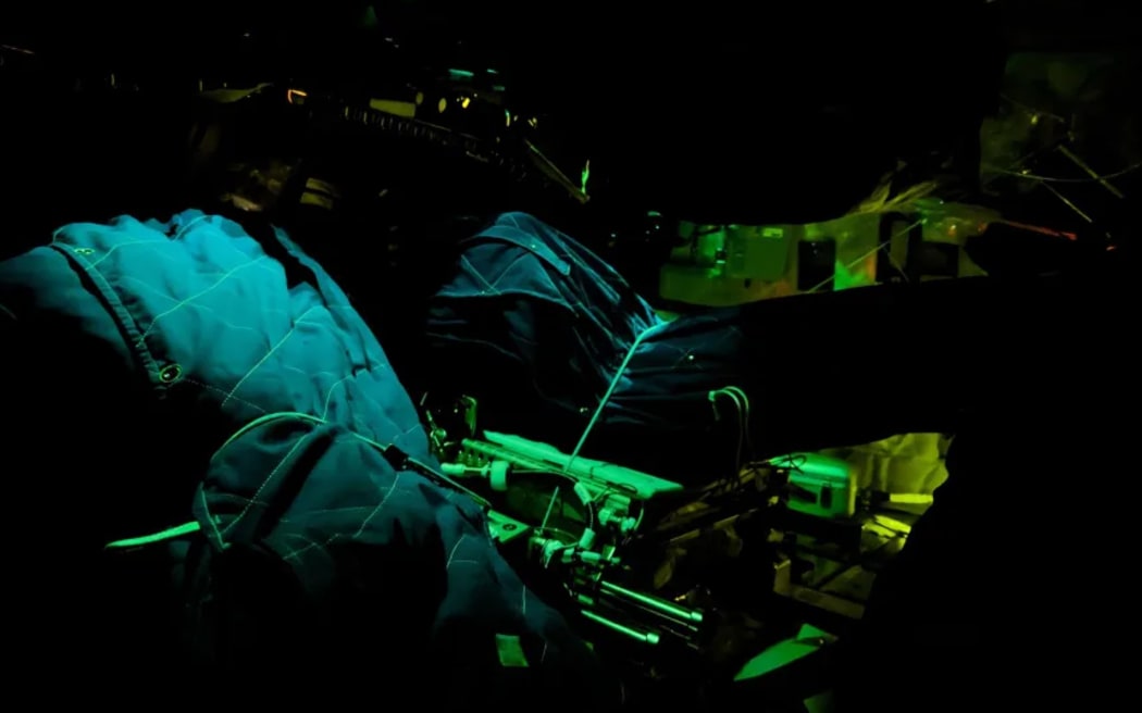 Artemis II sleeping bags are illuminated inside the Orion spacecraft on Flight Day 5 of the mission.