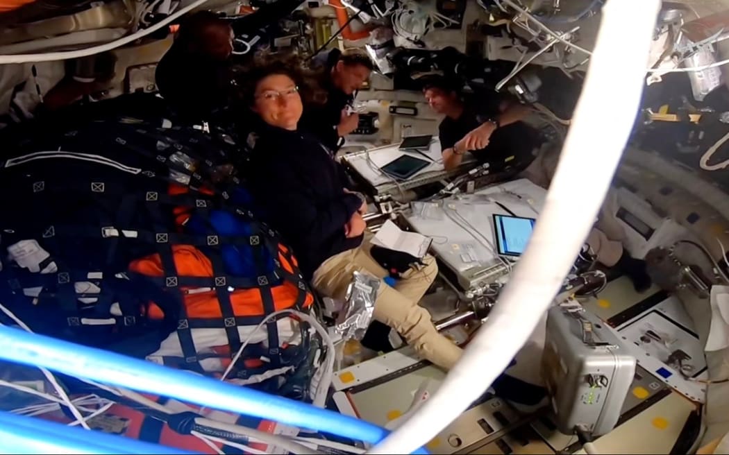 This screengrab taken from a NASA livestream shows Artemis II crew NASA's pilot Victor Glover, NASA's commander Reid Wiseman, Canadian Space Agency's mission specialist Jeremy Hansen and NASA's mission specialist Christina Koch aboard Orion Integrity spacecraft on 6 April 2026.