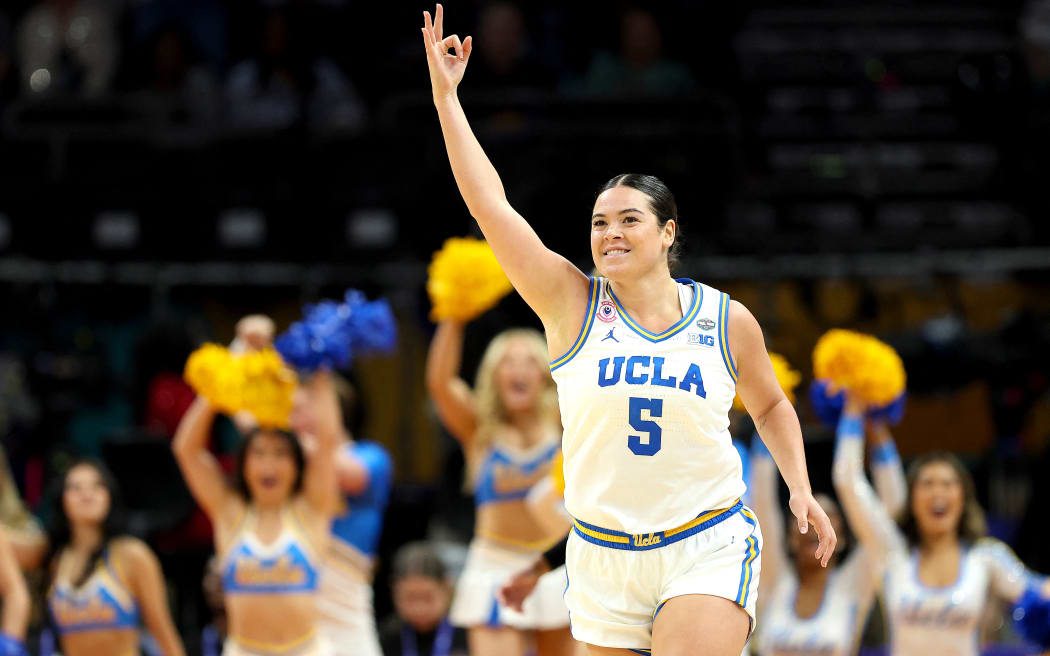 PHOENIX, ARIZONA - APRIL 05: Charlisse Leger-Walker #5 of the UCLA Bruins reacts after her three-point basket against the South Carolina Gamecocks during the third quarter in the National Championship of the NCAA Women's Basketball Tournament at Mortgage Matchup Center on April 05, 2026 in Phoenix, Arizona.   Sarah Stier/Getty Images/AFP (Photo by Sarah Stier / GETTY IMAGES NORTH AMERICA / Getty Images via AFP)