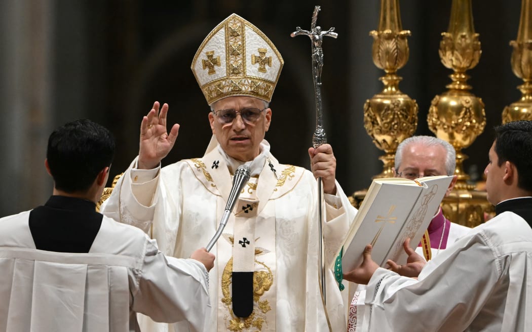 Pope Leo XIV presides over the Easter vigil as part of the Holy Week celebrations, at St Peter's basilica in the Vatican on April 4, 2026. (Photo by Andreas SOLARO / AFP)