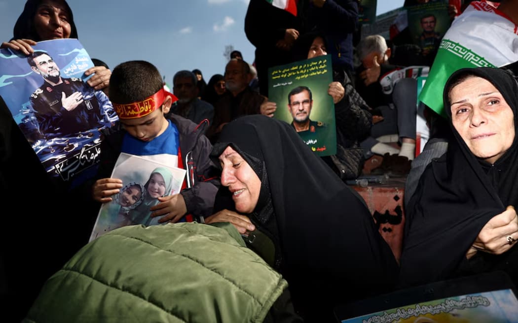People attend a funeral ceremony in Tehran, Iran. (Majid Asgaripour/WANA (West Asia News Agency) via Reuters)