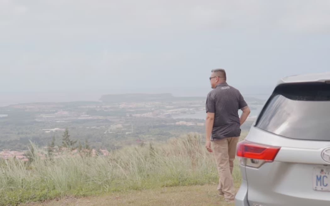 Roy Gamboa overlooking land forcibly acquired from his grandfather.
