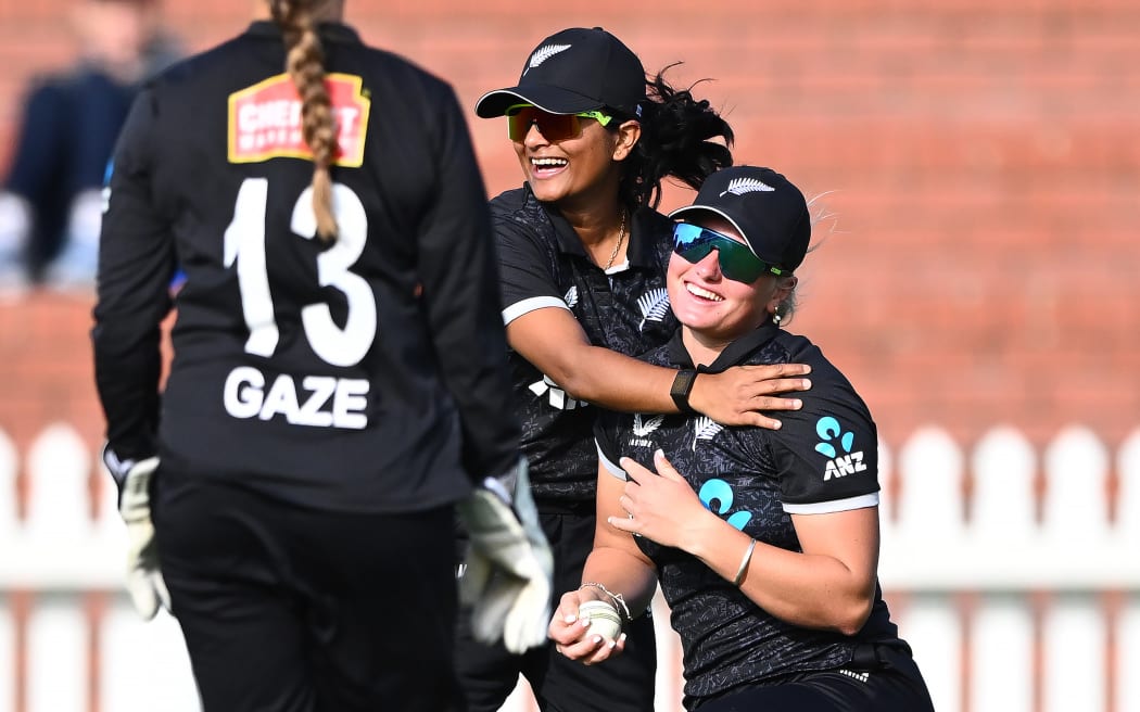 New Zealand White Ferns Nensi Patel (C) and Izzy Sharp (R) celebrate a wicket during the ODI series against South Africa.