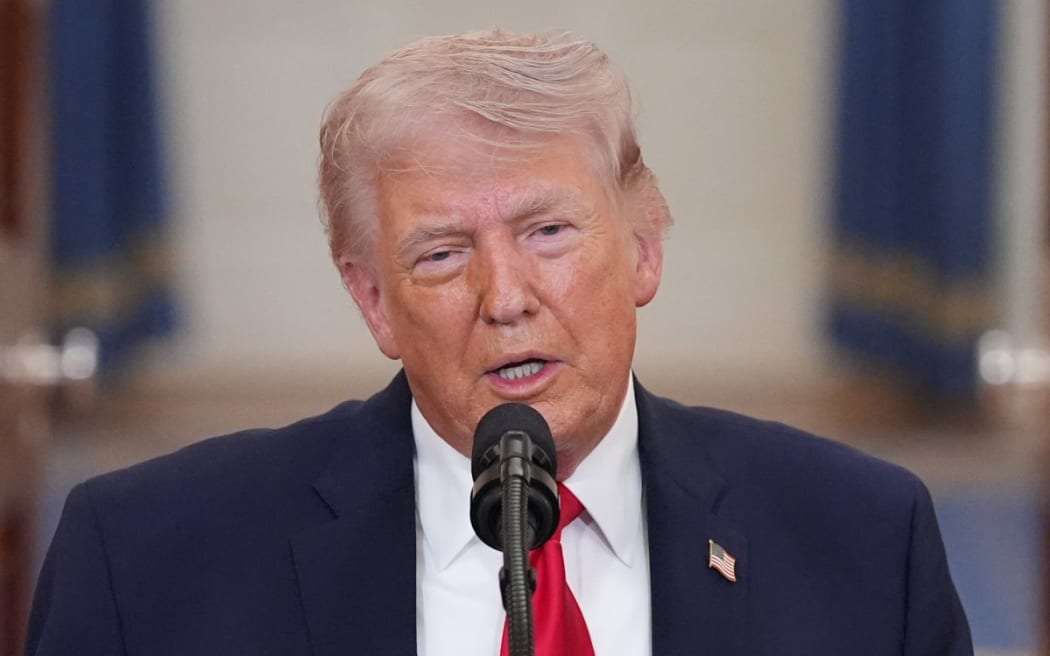 US President Donald Trump speaks during a televised address on the conflict in the Middle East from the Cross Hall of the White House in Washington, DC on April 1, 2026. President Donald Trump made his case for attacking Iran in his first nationwide address more than a month into the war, insisting the United States was close to victory as his approval rating sinks. In an evening speech from the White House, Trump broke little new ground on how the war would end and vowed two to three weeks further of 