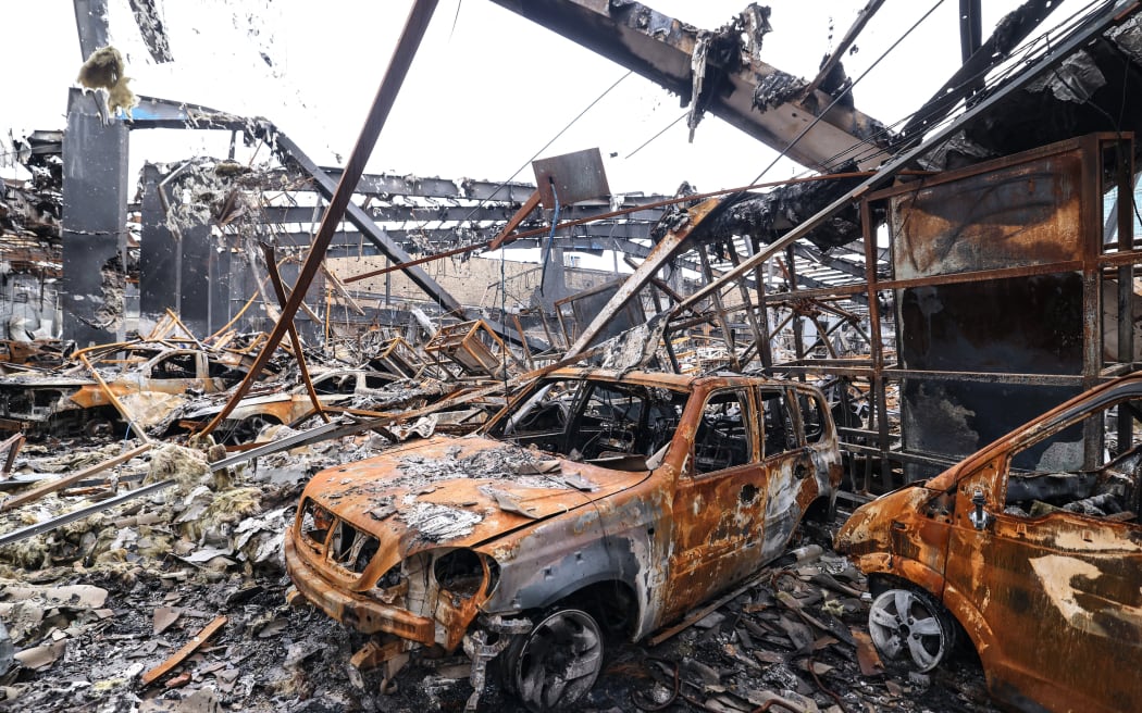 A photograph shows the damage during the visit of car service centre in eastern Tehran that was hit by a missile strike, on March 28, 2026. Israel and the United States launched strikes on Iran on February 28, killing the Islamic republic's supreme leader and sparking a war that has since spread across the Middle East. (Photo by ATTA KENARE / AFP) /