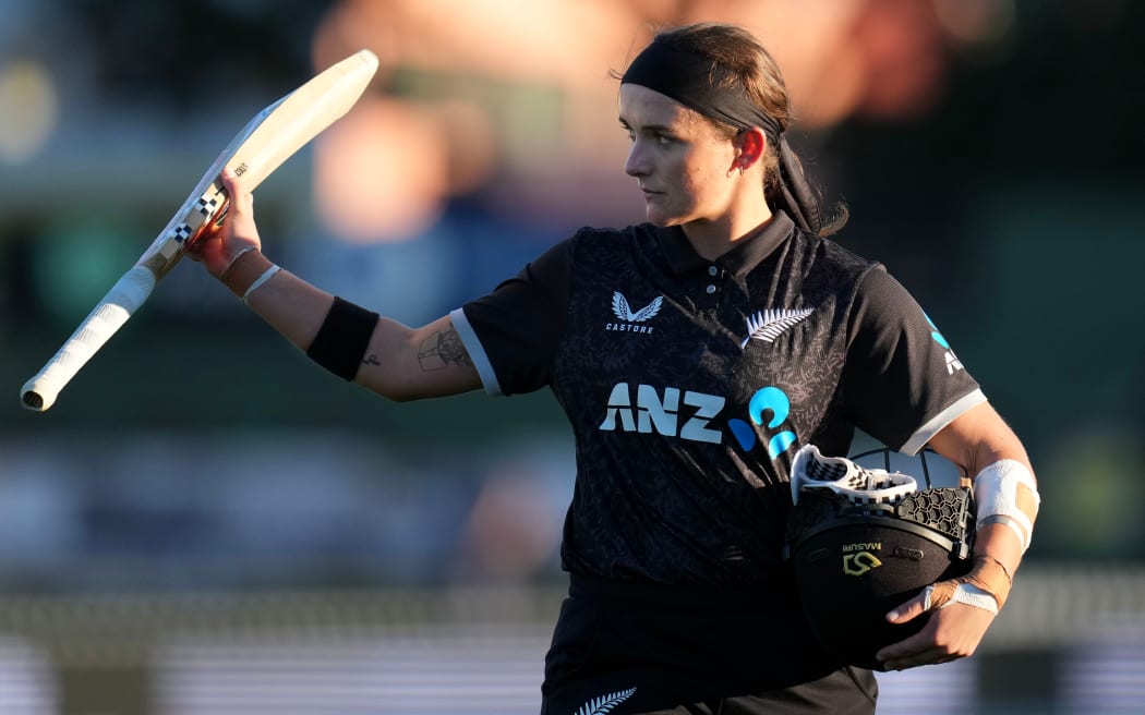 White Ferns captain Melie Kerr salutes the crowd.
