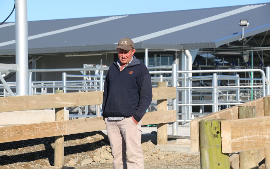 Farmer Rod May outside a new dairy shed being built on his farm.