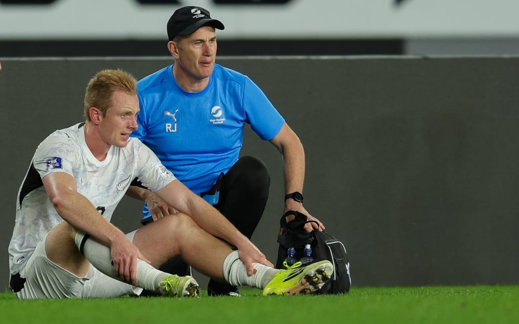 All White Francis de Vries goes off injured during New Zealand vs Finland.