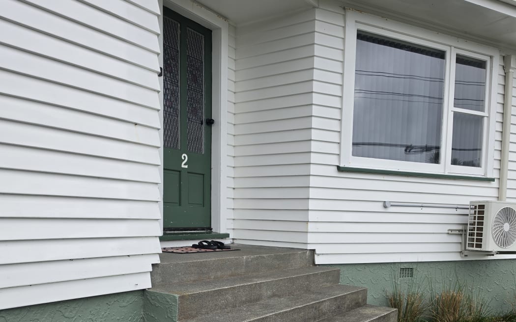 The stairs that Dinson Thomas has to carry his daughter up in order to get inside their home.