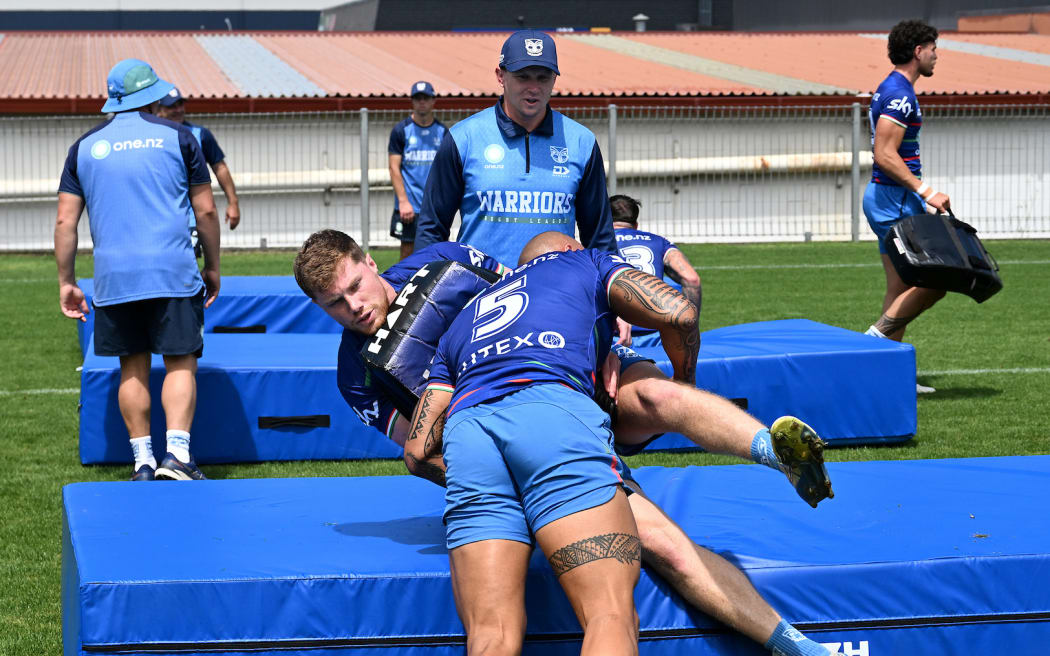Morgan Gannon is tackled by Tanner Stowers-Smith. New Zealand Warriors pre-season NRL rugby league training at Go Media Stadium.