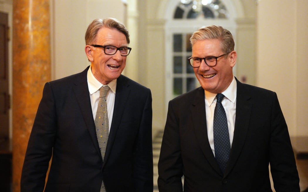 British Prime Minister Keir Starmer (R) talks with Britain's Ambassador to the United States Peter Mandelson during a welcome reception at the ambassador's residence on February 26, 2025 in Washington, DC. British Prime Minister Keir Starmer is on his first visit to Washington since US President Donald Trump returned to the White House. (Photo by Carl Court / POOL / AFP)