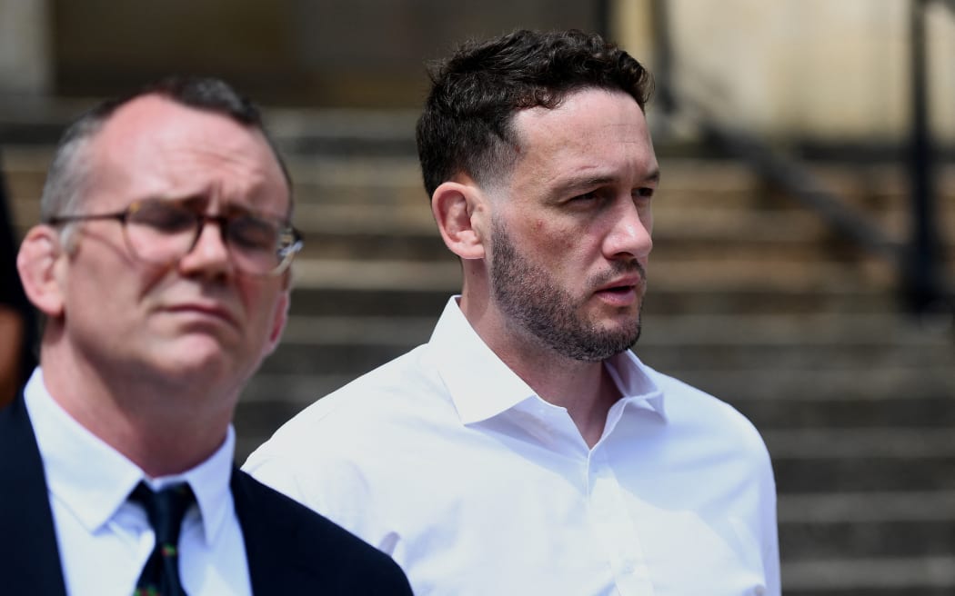 New Zealand rugby player Rory Grice (R) leaves the court following a hearing at the Bordeaux courthouse, south-western France on 17 June, 2024.