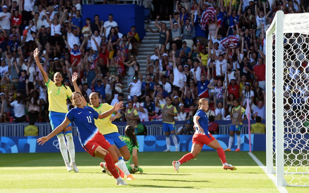 USA's Mallory Swanson scores a goal as Brazil defenders claim for a offside during the Paris Olympics 2024.
