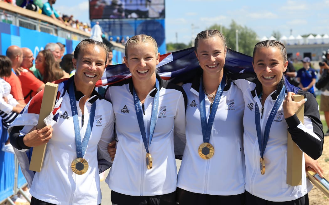 (L-R) Dame Lisa Carrington, Tara Vaughan, Olivia Brett and Alicia Hoskin win gold in the women’s K4 final at the 2024 Paris Olympics.