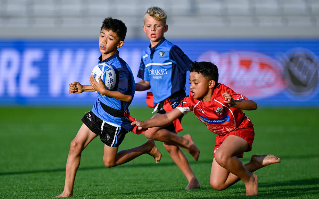 Children playing rippa rugby.