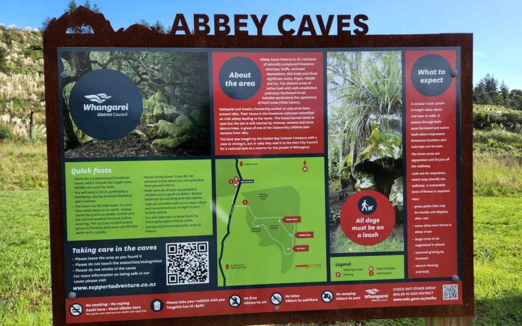 An information board at the Abbey Caves near Whangārei.