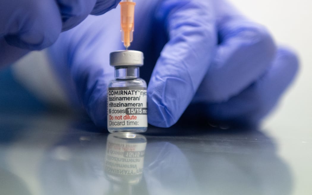 A healthcare worker member draws up a syringe with the BioNTech, Pfizer vaccine adapted to the Omicron-BA.1 variant.