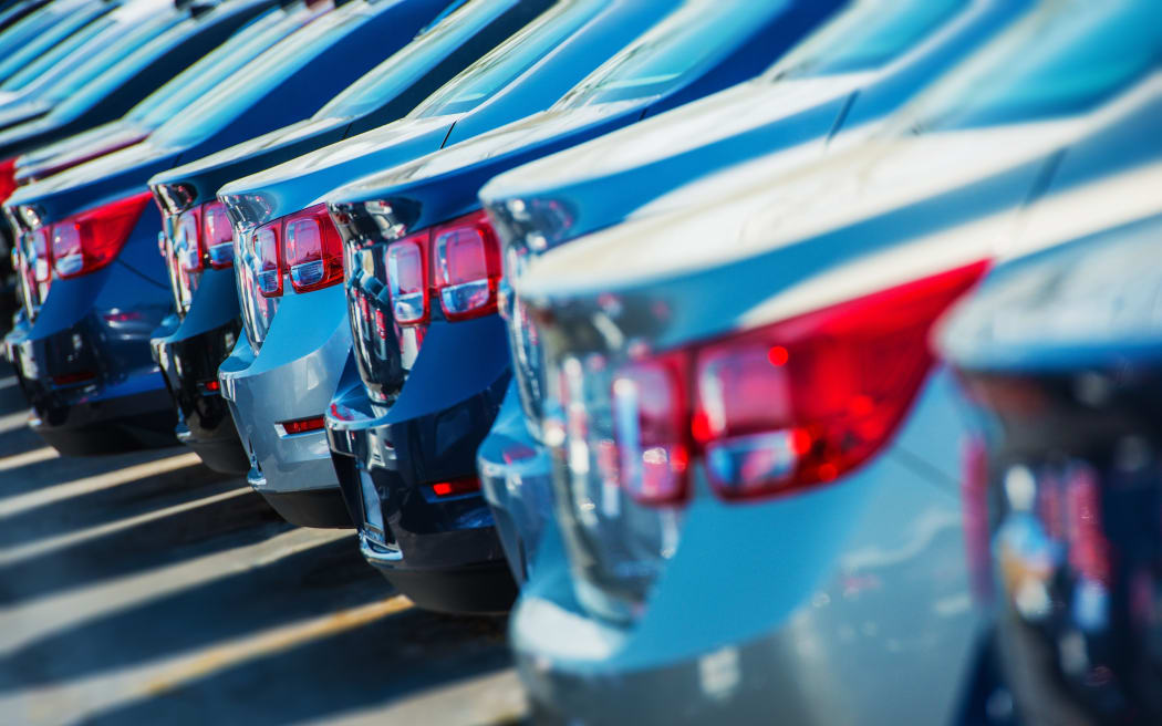 Parked cars for sale, car yard.