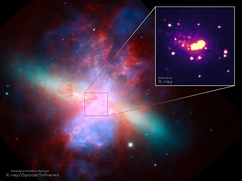 A full version of the header image, showing a colorful view of space with a boxout showing Chandra's view only, revealing glowing blobs.