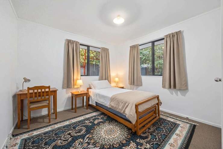 Zuhaib Bangash's four-bedroom home on Woodbank Drive, in Auckland's Glen Eden, was listed with a Ray White agent who has a track record of beating the bank. Photo / Supplied