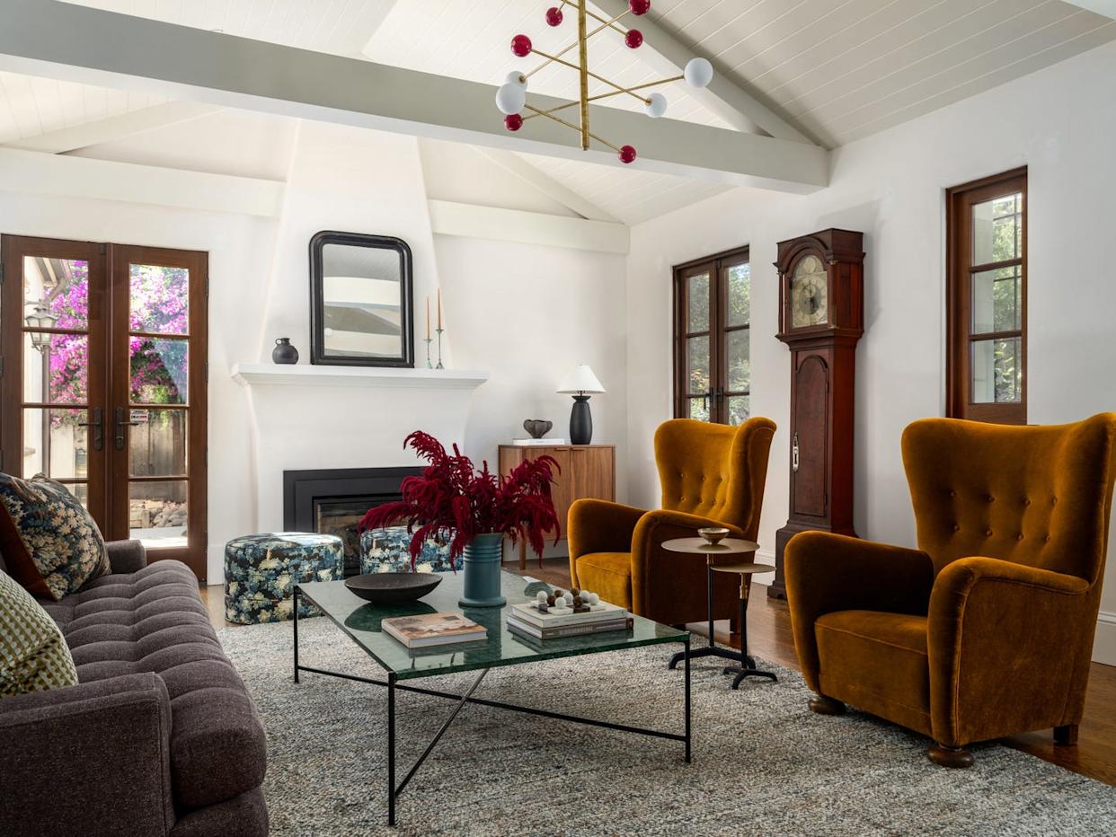 Modern living room with vintage furniture and natural light.