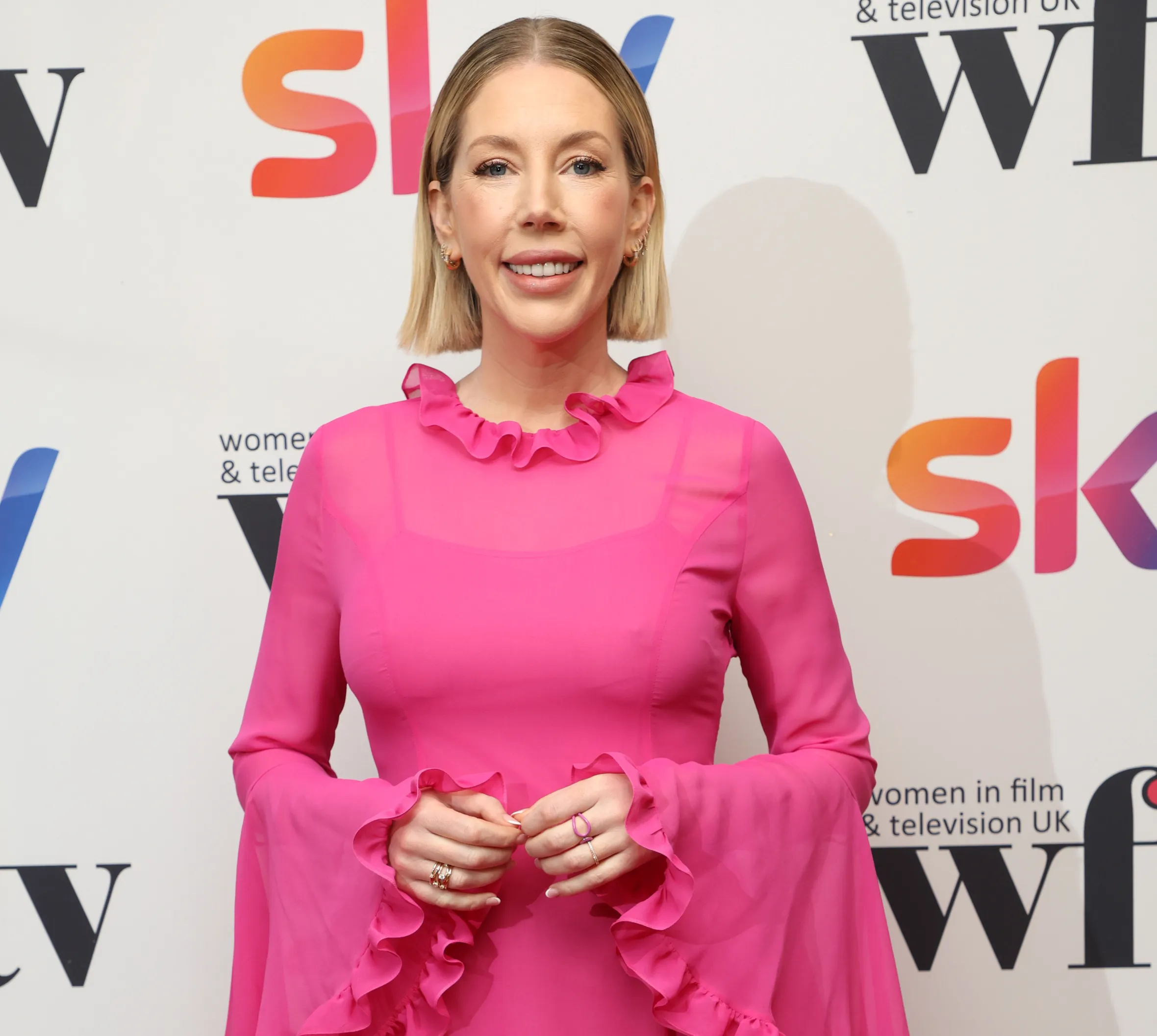 Katherine Ryan in a pink ruffled gown at the Sky Women in Film and Television Awards 2023.