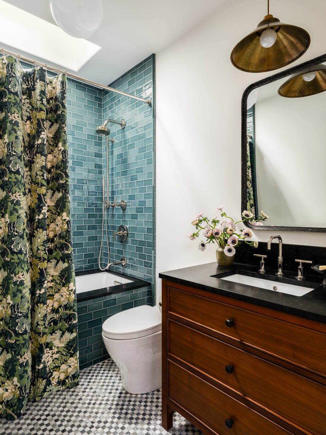Bathroom with a shower area, toilet, and vanity
