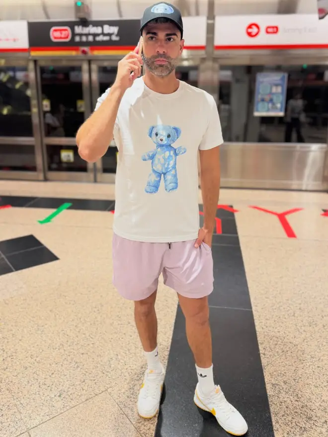 Joel pictured posing with his teddy on his t-shirt.