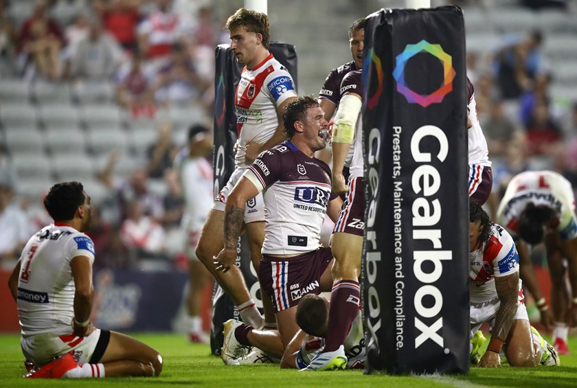 Kobe Hetherington celebrates Manly's 28-18 win against the Dragons.